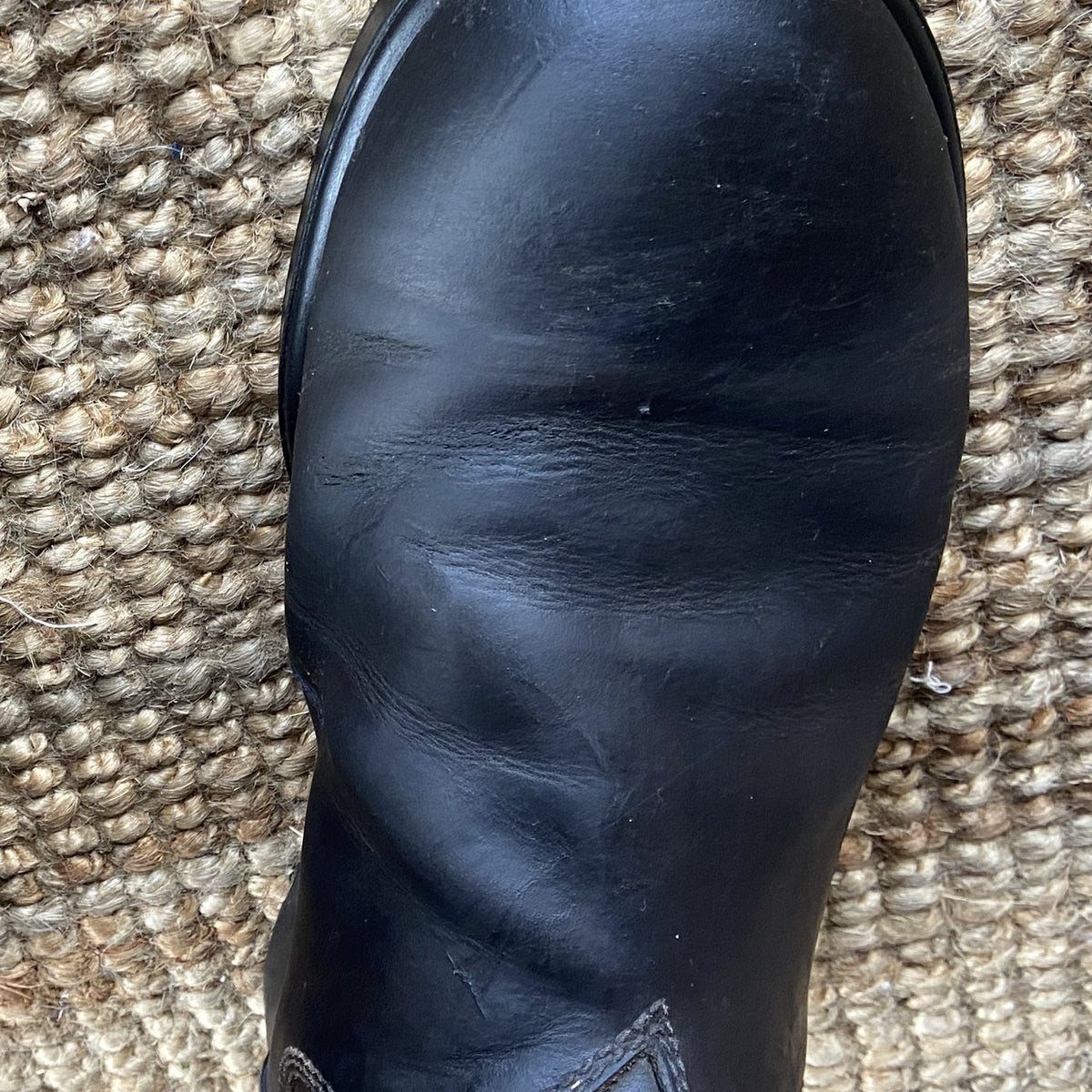 The same boot after Renapur Leather Balsam, deep black and restored